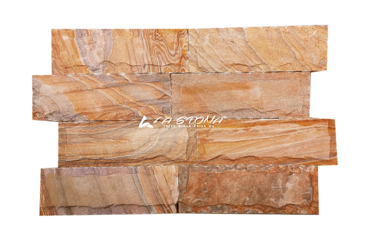 RUBY CHIZEL natural stone cladding with warm golden flowing layered texture