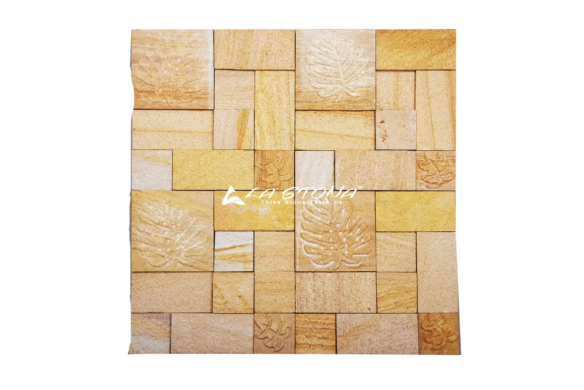 PALM LEAF exclusive decorative sandstone wall panel with engraved tropical palm leaf motifs in warm golden sandstone tones