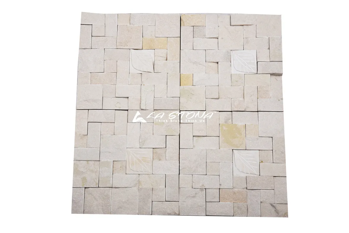 ASPEN exclusive natural stone wall cladding with ivory geometric ashlar mosaic and engraved leaf accents