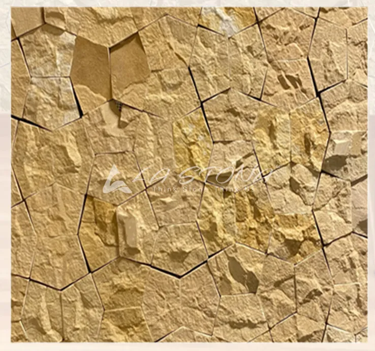 ROCK STAR YELLOW natural stone cladding with a three-dimensional fractured rock mosaic in golden yellow sandstone