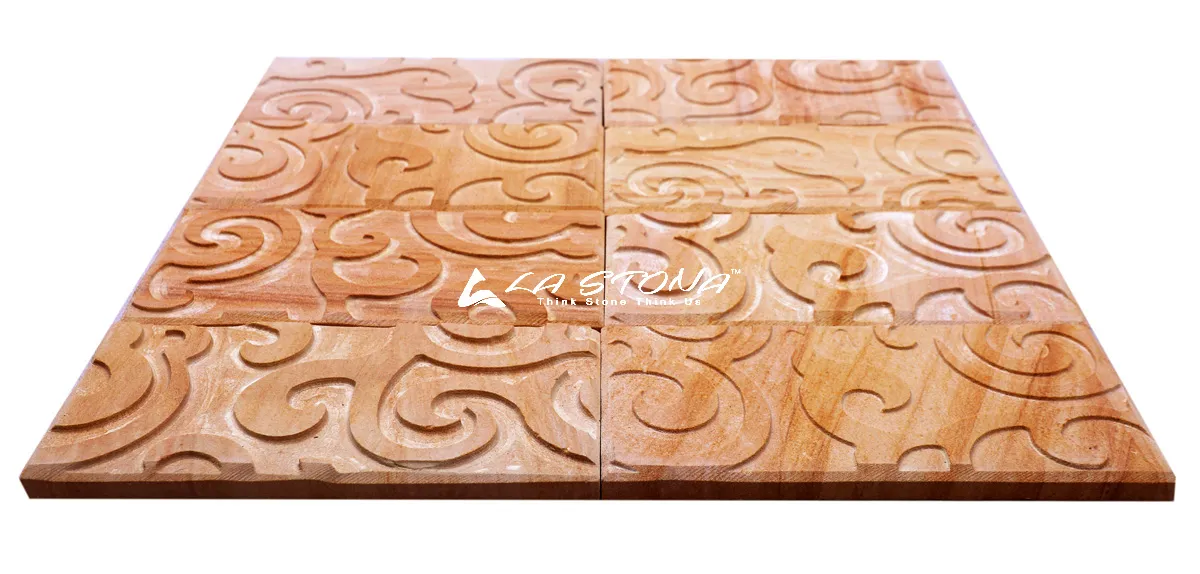 ISLAND OAK DECO natural stone cladding with deep engraved spiral decorative patterns in warm oak sandstone